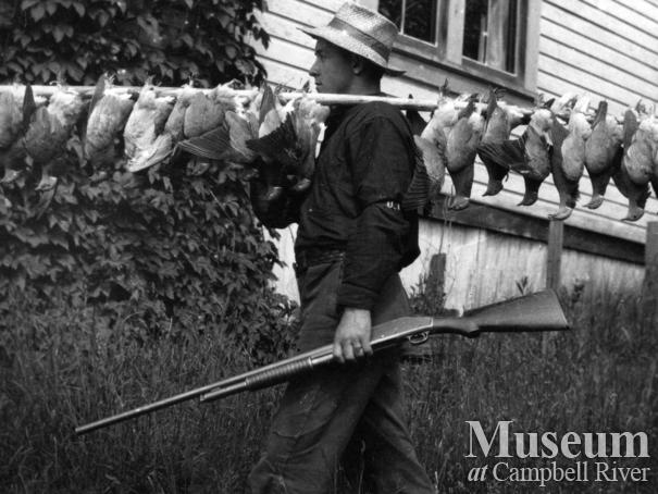 Rob Yeatman with dead pidgeons, Quadra Island