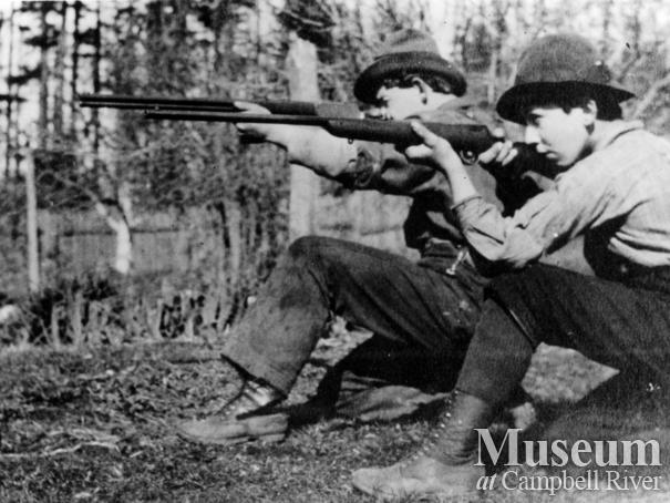 Yeatman brothers with their rifles at Sunny Side Farm, Quadra Island	