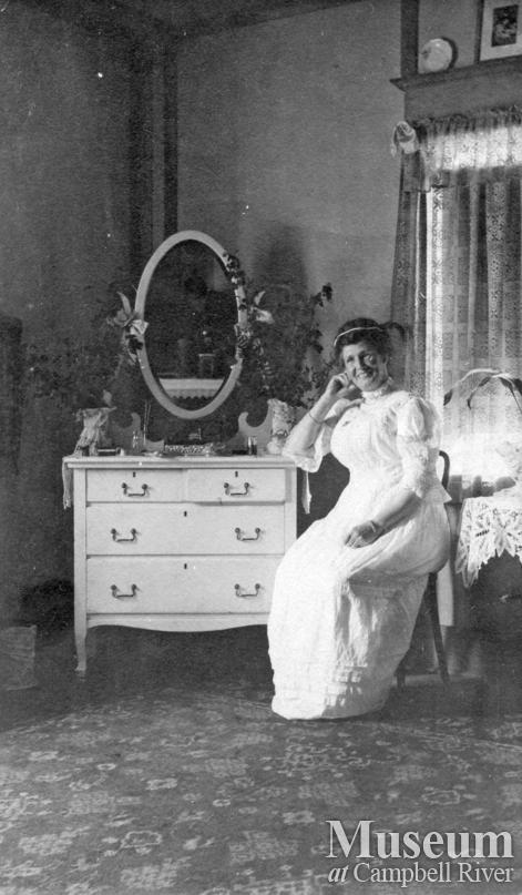 Mrs. James A. Nixon in her bedroom at Twin Islands