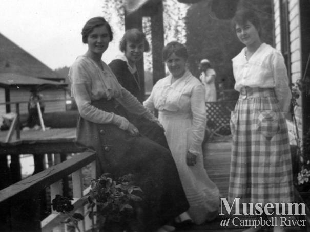 Group on the porch of the Anderson home, Quathiaski Cove, Quadra Island