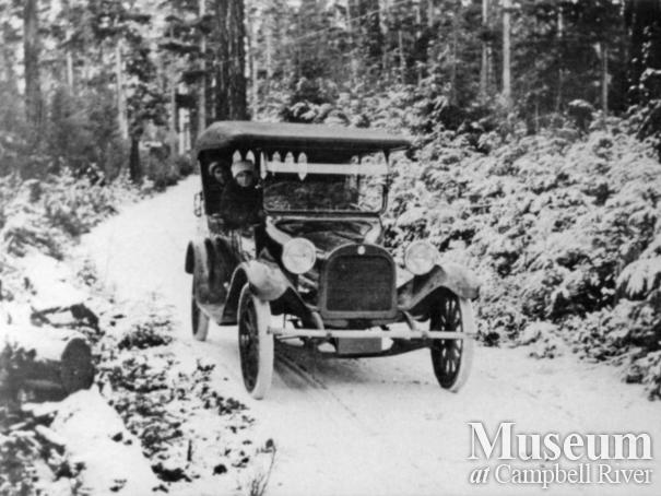 Anderson family car on road in the winter, Quathiaski Cove, Quadra Island	